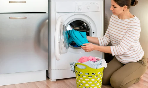 casual woman doing laundry jpg
