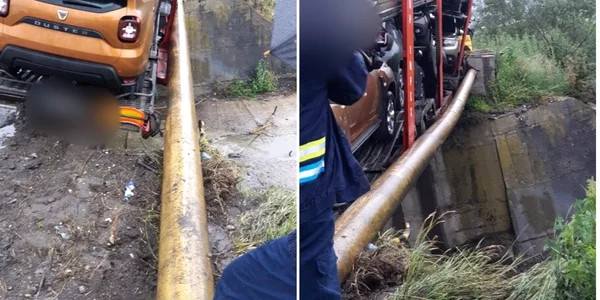 TIR plin cu maşini oprit de o conductă de gaze pentru a nu pica în râpă pe şoseaua de centură a staţiunii Călimăneşti - Vâlcea pe Valea Oltului Foto Adevărul