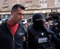Persoane sunt aduse de către polițiști la sediul Direcției Generale de Poliție a Municipiului București în dosarul legat de violențele de la protestul din Piața Victoriei din data de 15 septembrie 2026  Inquam Photos / George Călin