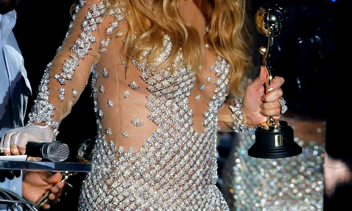 Singer Mariah Carey reacts after receiving the Pop Icon Award during the World Music Awards in Monte Carlo jpeg