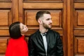 young couple love front wooden door jpg
