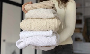 close up woman carrying clothes jpg