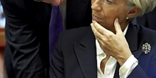 Christine Lagarde, director FMI, şi Jean Claude Juncker, şeful Eurogrup, înaintea Consiliului de duminică, 23 octombrie