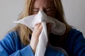 2 woman blow blowing nose jpg jpeg
