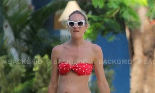 *EXCLUSIVE* Candice Swanepoel displays her pregnant belly on a stroll in Trancoso jpeg