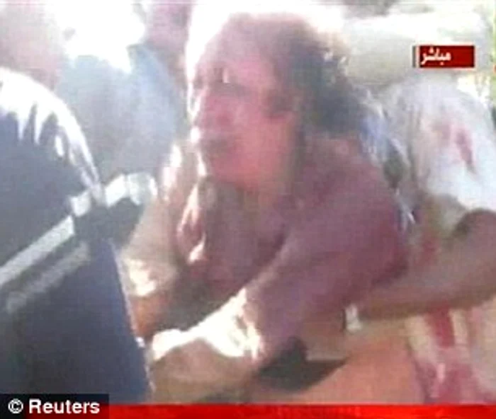 Gaddafi şi-a implorat călăii să-l cruţe