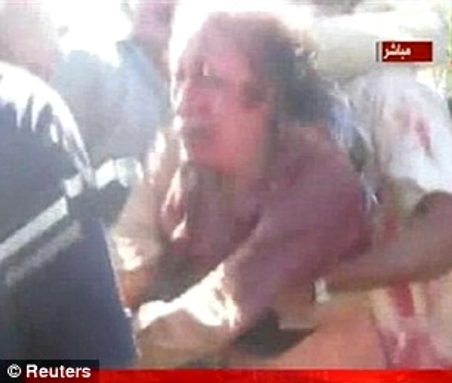 Gaddafi şi-a implorat călăii să-l cruţe