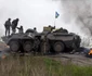 Ucraina - Soldaţi ucraineni stau de pază la un punct de control de lângă Slaviansk FOTO Reuters