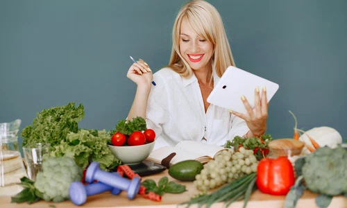 beautiful girl make salad sporty blonde kitchen woman writing recipe notebook jpg