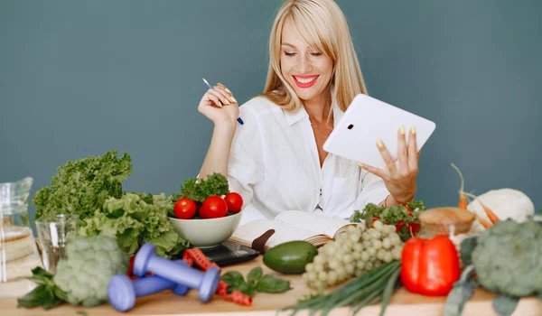 beautiful girl make salad sporty blonde kitchen woman writing recipe notebook jpg