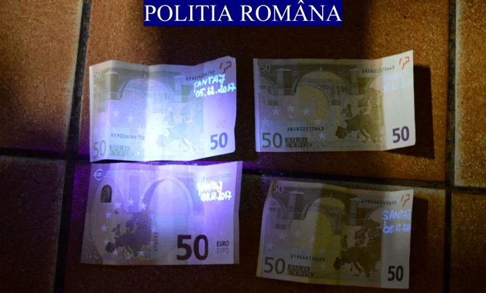 Imagine cu banii daţi şantajistului prins în flagrant delict FOTO IPJ Cluj
