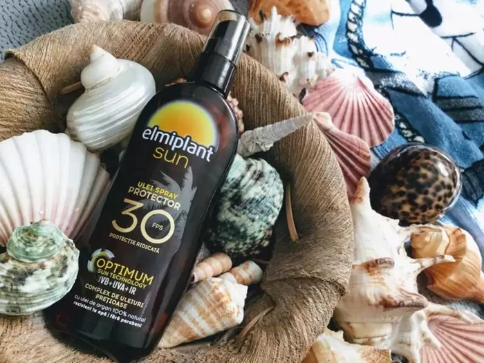 Prezentare ulei autobronzant cu protecție solară Elmiplant Sun SPF 30 printre scoici F: Dark Passion