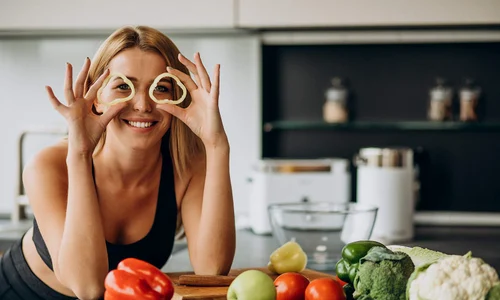 young sporty woman with pepper kitchen jpg