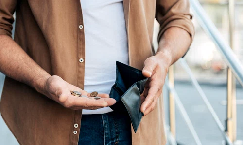 close up hands holding wallet coins (5) jpg