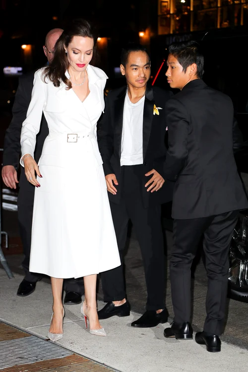 Angelina Jolie pose with Maddox and Pax while they where arriving at the after party in New York City jpeg