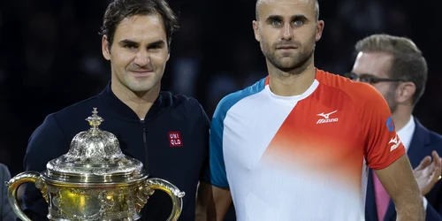 Marius Copil si Roger Federer. FOTO EPA-EFE