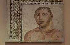 Un mozaic din Băile lui Caracalla ce reprezintă portretul unui boxer, expus la Museo Nazionale Romano (© Carole Raddato / Wikimedia Commons)