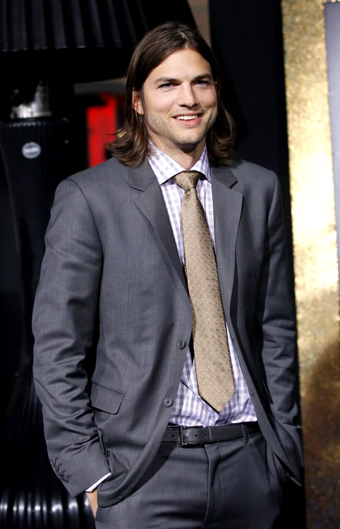 Ashton Kutcher poses at the premiere of "New Year's Eve" at the Grauman?s Chinese theatre in Hollywood jpeg