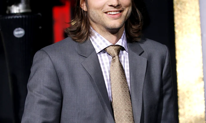 Ashton Kutcher poses at the premiere of "New Year's Eve" at the Grauman?s Chinese theatre in Hollywood jpeg
