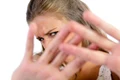 young woman hiding from camera jpg