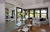 Liam Hemsworth's house cost $ 6 8 million It is a ranch style house 1950s Front is all window It has hardwood floors Apparently it has both window, but it's all super technologized, as the windows are handled easily by remote control jpeg