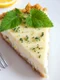 Piece of delicious homemade lemon cheesecake with mint close up jpeg