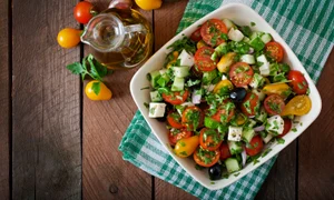 43879467   greek salad with fresh vegetables, feta cheese and black olives jpeg