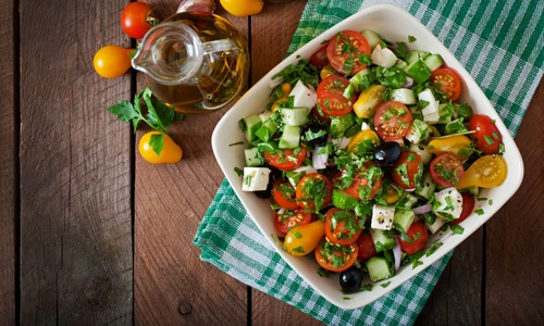 43879467   greek salad with fresh vegetables, feta cheese and black olives jpeg