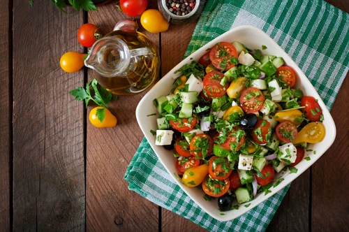 43879467 greek salad with fresh vegetables, feta cheese and black olives jpeg