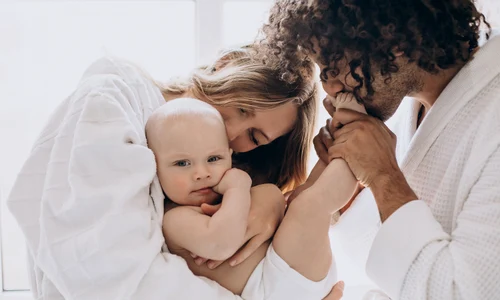 multicultural family with their little son having fun together jpg