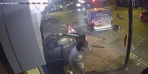 Three men emerge from the wreckage of the car and flee