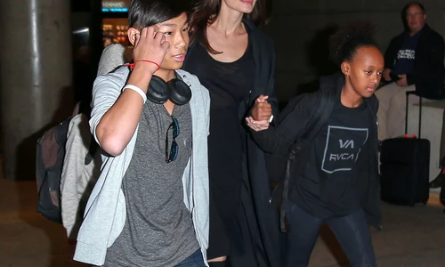 Angelina Jolie & Kids Arriving On A Flight At LAX jpeg