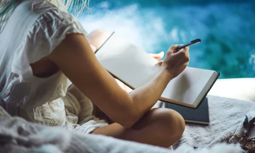 happy girl spends time home cozy interior writes draws notebook jpg