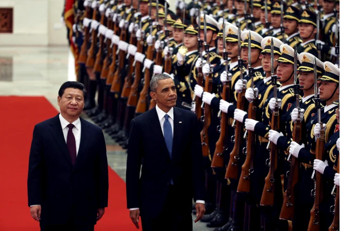 Președintele SUA, Barack Obama (dreapta), vizitează China în 2014