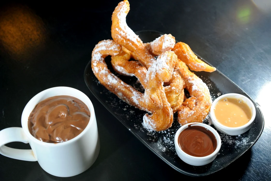 12023669   churros chocolate, a typical spanish sweet snack jpeg