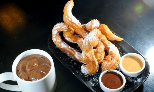 12023669   churros chocolate, a typical spanish sweet snack jpeg