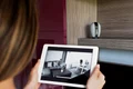 close up woman checking security camera jpg