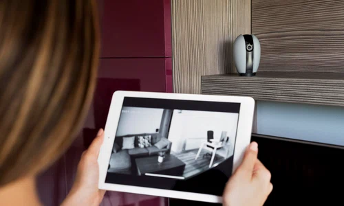 close up woman checking security camera jpg