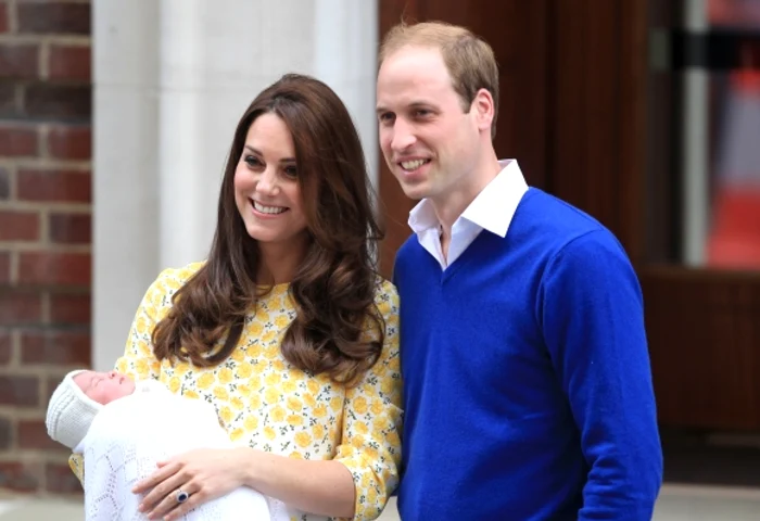 
    Prinţul William împreună cu soţia sa, Kate, şi fiica lor, CharlotteFoto: WENN  
