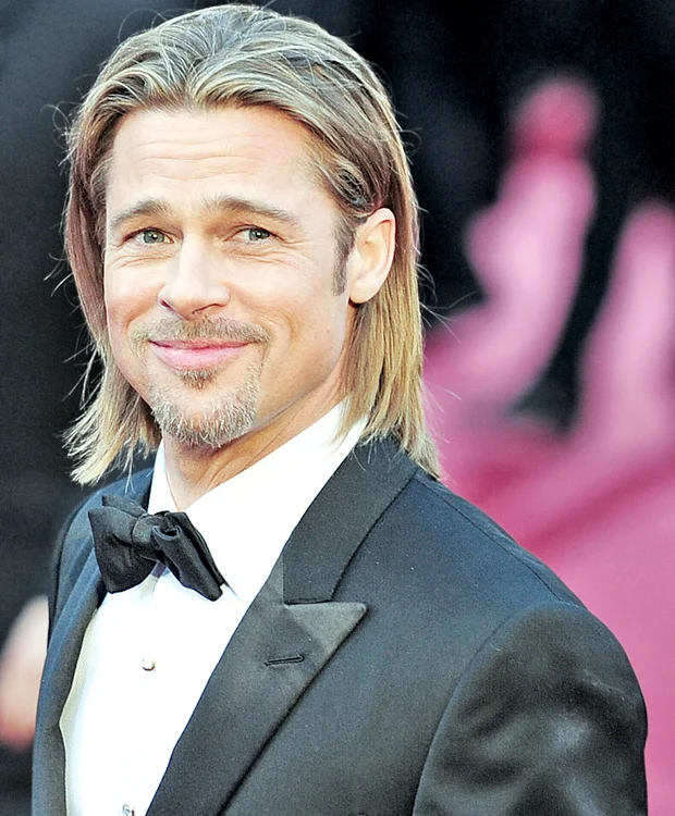 Angelina Jolie se preface că totul este în regulă, Brad Pitt se gândeşte la Jennifer Aniston. (Foto: EPA)