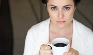 closeup serious nice businesswoman with coffee jpg