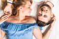 elevated view young couple lying bed jpg