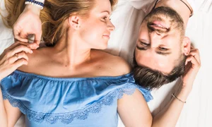 elevated view young couple lying bed jpg