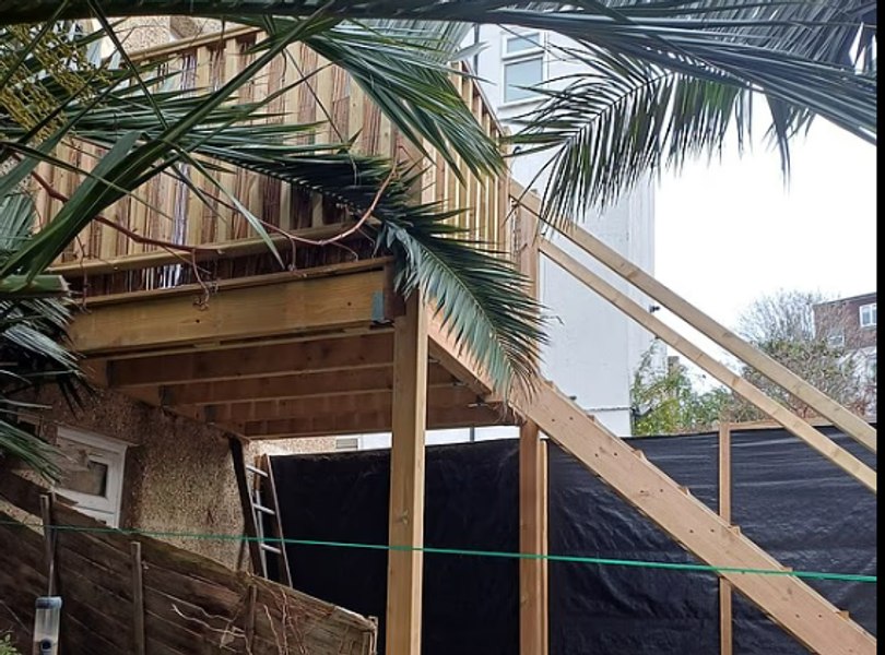 Retiree calls neighbor's garden platform an 'East German guard tower' after it blocks sun