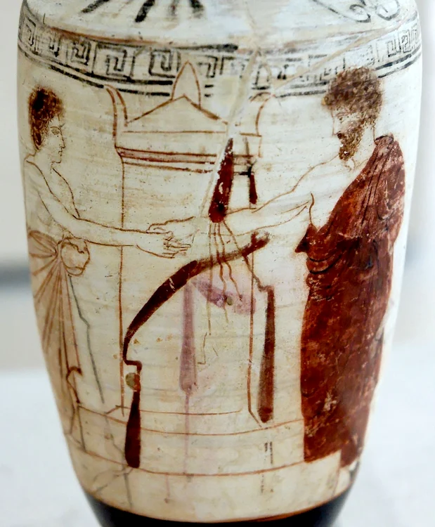 O dexiosis (strângere de mână) într-un context funerar, pe un ulcior grecesc (© Wikimedia Commons)