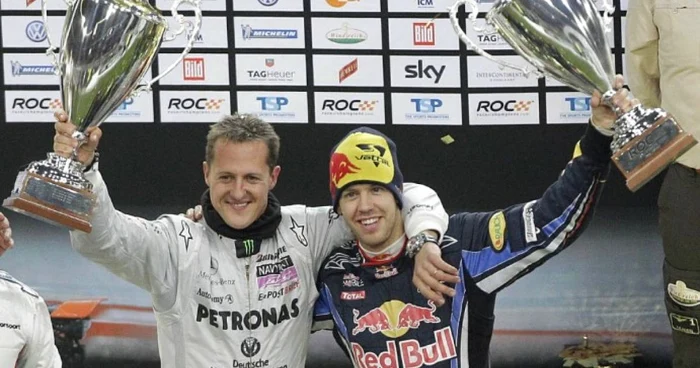 Schumacher (stânga) s-a retras din F1 în ziua în care Vettel (dreapta) a devenit triplu campion mondial