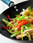 Stir fry with mixed vegetables and chicken in a wok jpeg