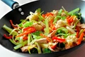 Stir fry with mixed vegetables and chicken in a wok jpeg