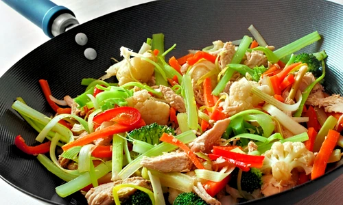 Stir fry with mixed vegetables and chicken in a wok jpeg