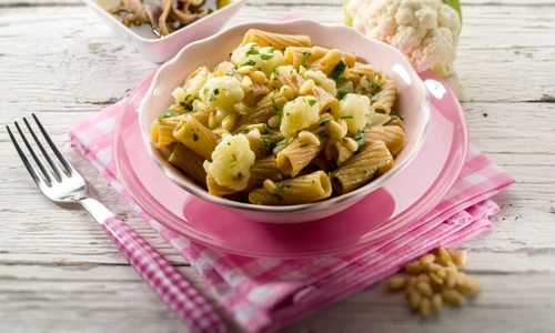 24935808   pasta with cauliflower ancovy and pine nuts, selective focus jpeg